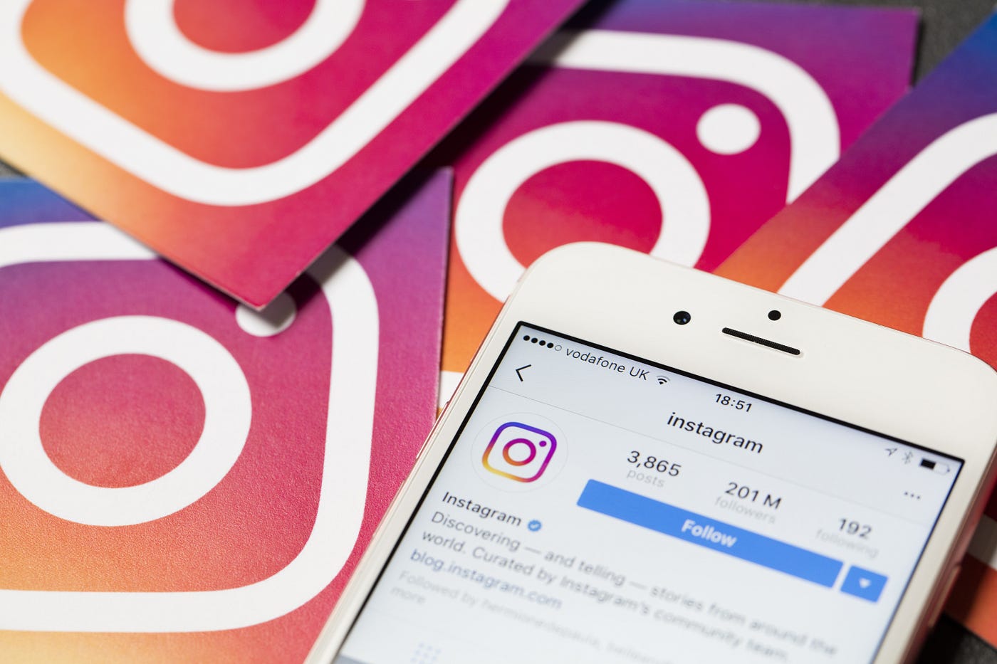 A smartphone displaying the Instagram app interface with a message notification icon.