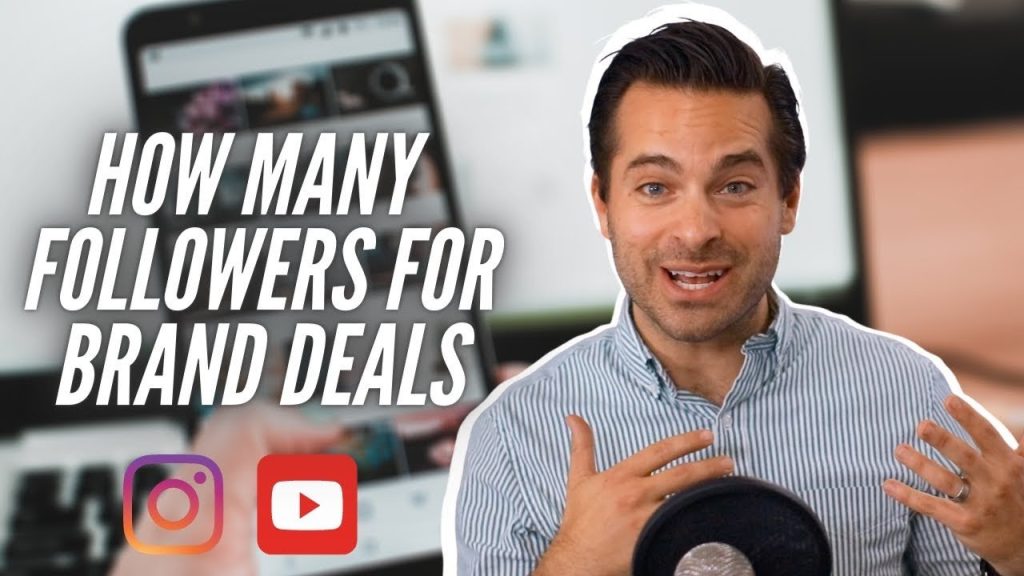 A person holding a smartphone displaying a social media app with follower count.